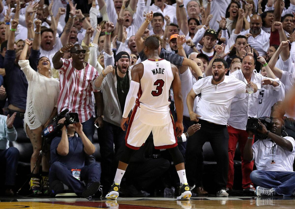 Heat guard Dwyane Wade (3) celebrates winning Game 4 against the Raptors.