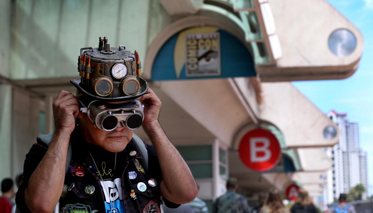 Ness "Nesshead" Magaña of Pacoima adjusts his steampunk goggles as he waits to get his entry badge to Comic-Con International last year at the San Diego Convention Center.