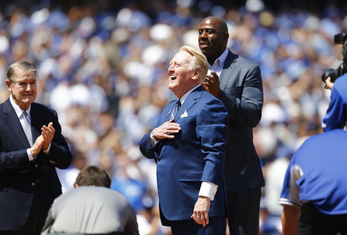 Dodgers announcer Vin Scully is honored at home plate on his last Opening Day at Dodger Stadium on Apr. 12.