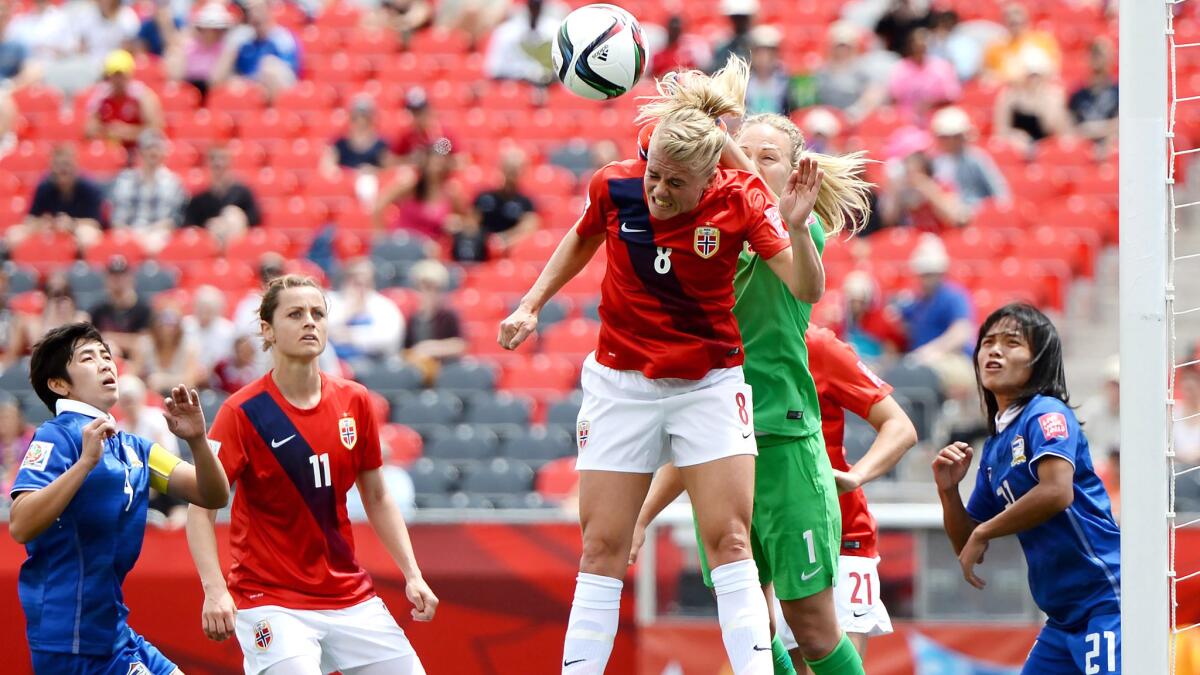 Norway defender Solveig Gulbrandsen (8) clears a pass by Thailand from in front of goaltkeeper Ingrid Hjelmseth during the first half of their Women's World Cup group game Sunday.