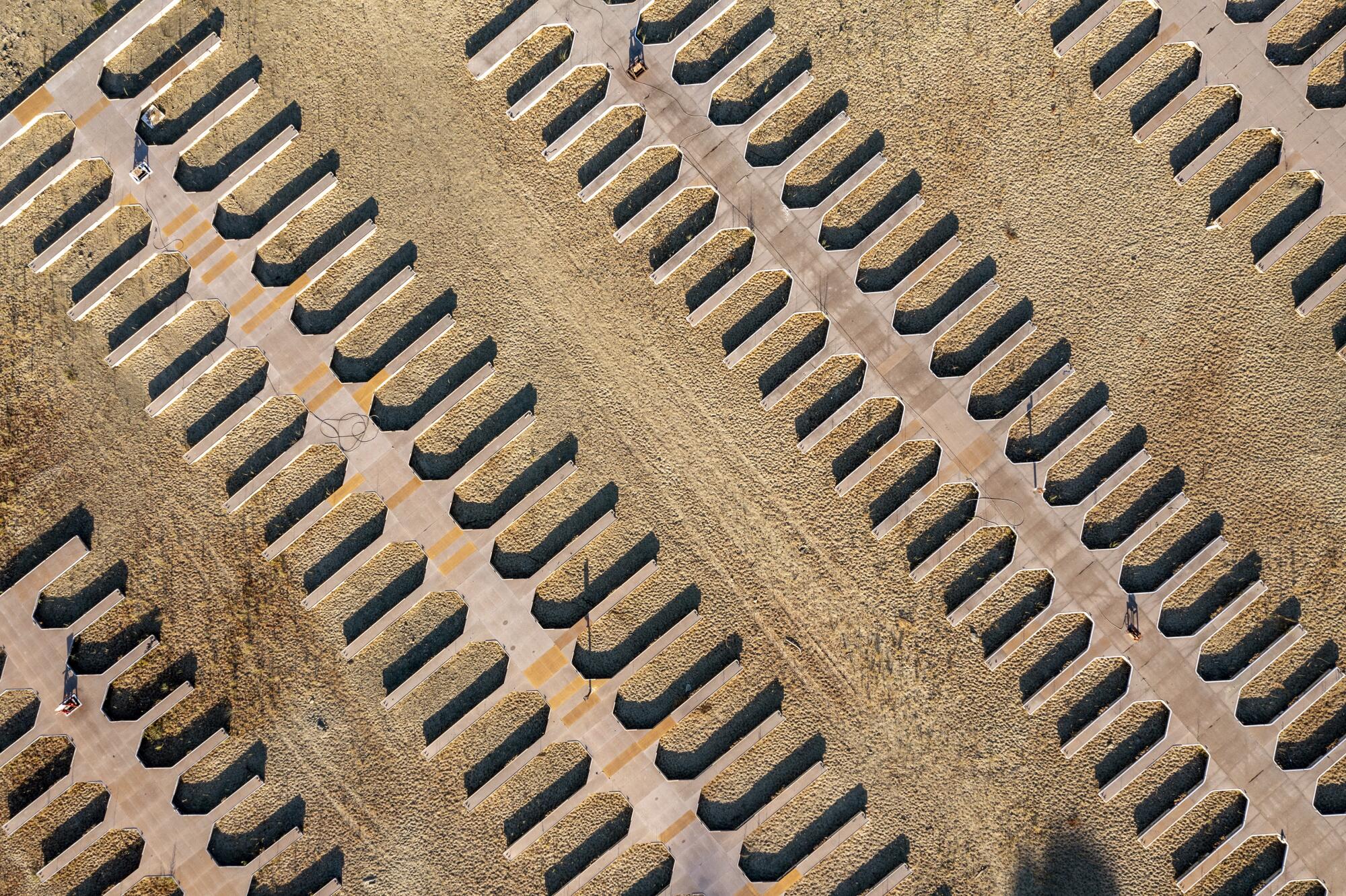 Boat slips line dry ground at a depleted lake