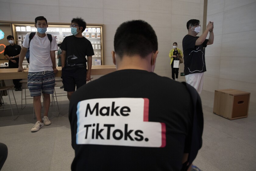 A man wearing a shirt promoting TikTok