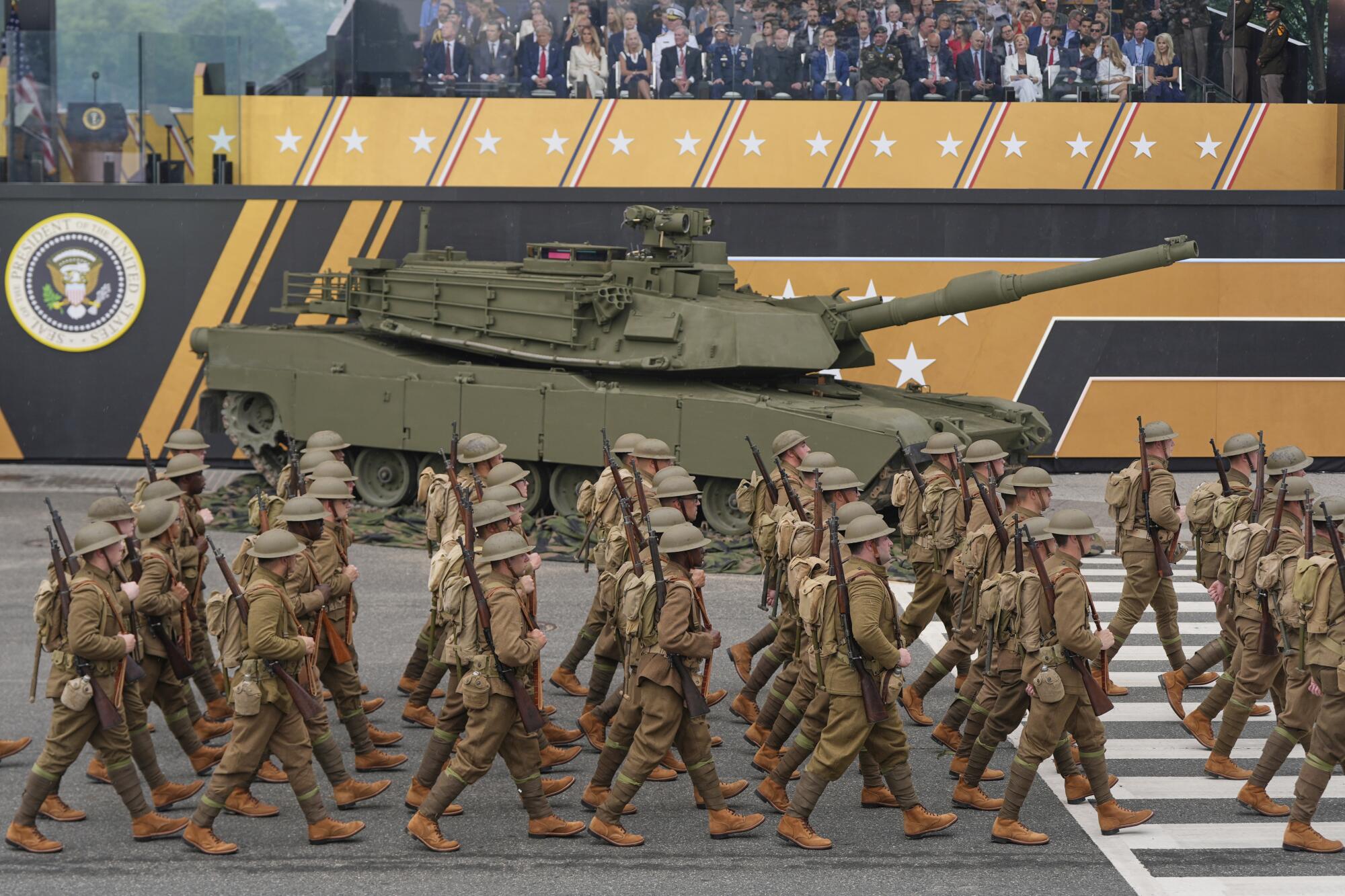 Soldiers from the Army 82nd Airborne Division, dressed in World War I-era uniforms, march past the reviewing stand.