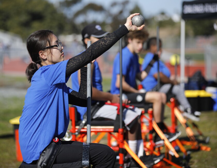 Ruby Melchior, a student at Scripps Ranch High, works on her shot put technique at an adapted sports clinic hosted by the Challenged Athletes Foundation at Clairemont High on January 12, 2020. Melchior, a former pole vaulter, suffered a brain injury and is now training in the seated shot put.