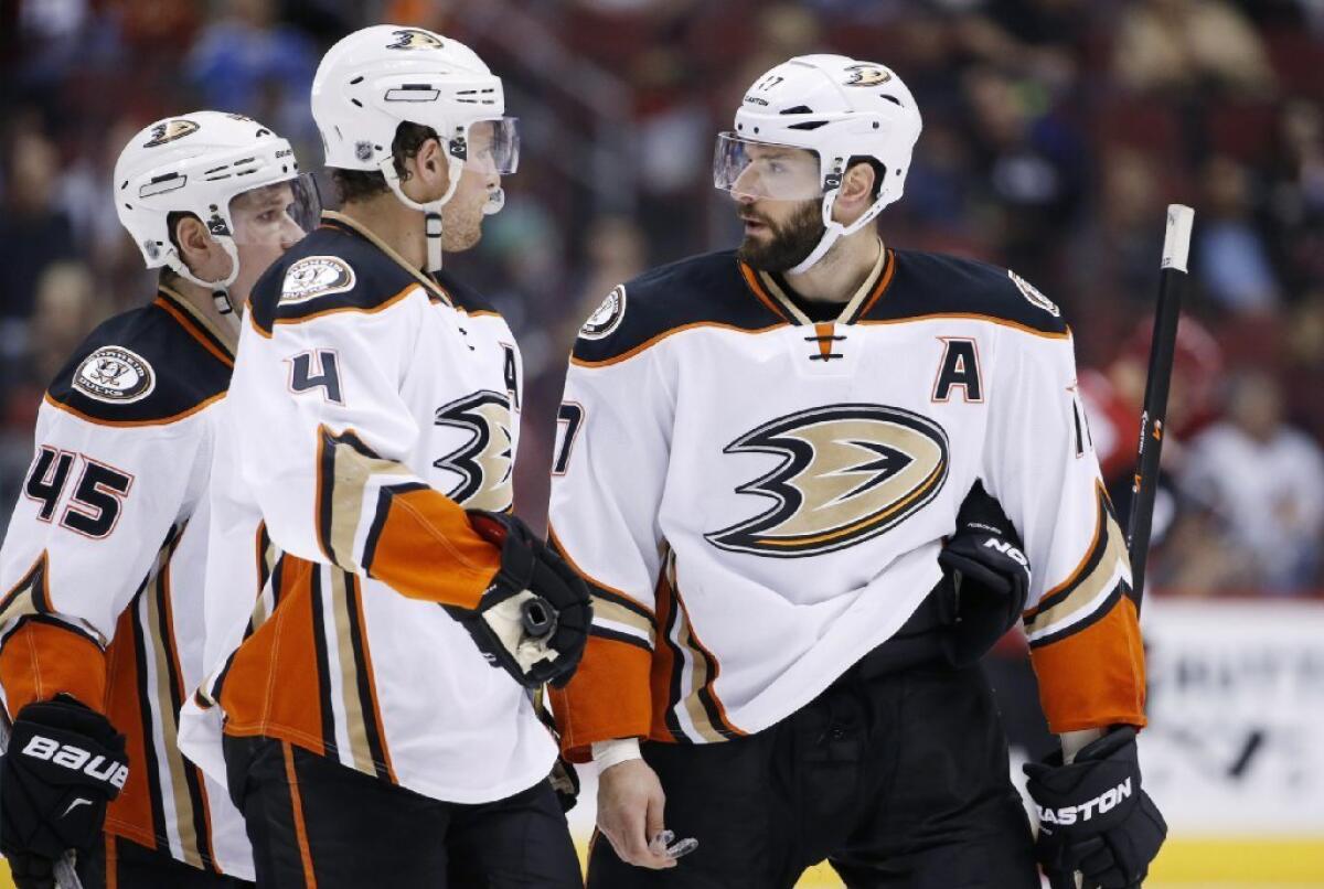 Ducks forward Ryan Kesler, right, talks with teammates Cam Fowler (4) and Sami Vatanen (45) during the second period of a game against the Arizona Coyotes on March 3, 2016.