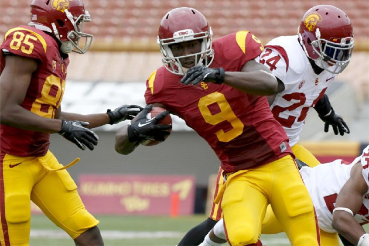 USC receiver Marqise Lee (9) runs with the ball after catching a pass during the team's final spring scrimmage.