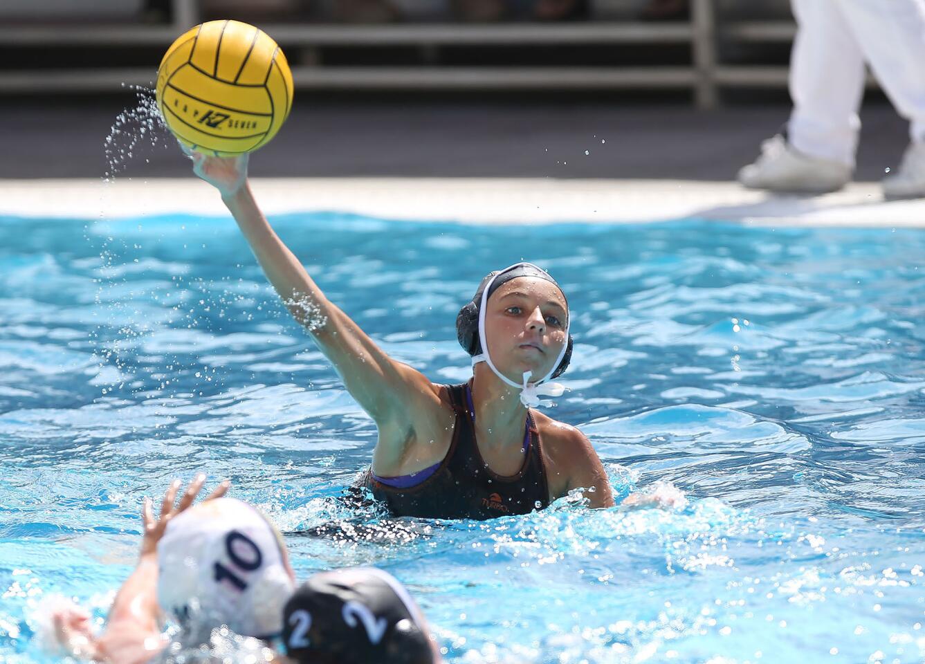 Huntington's Sadie Stinson shoots and scores into the corner of the net against Menlo School of Atherton during pool-play game of the California High School State Championships at Huntington Beach High on Friday.