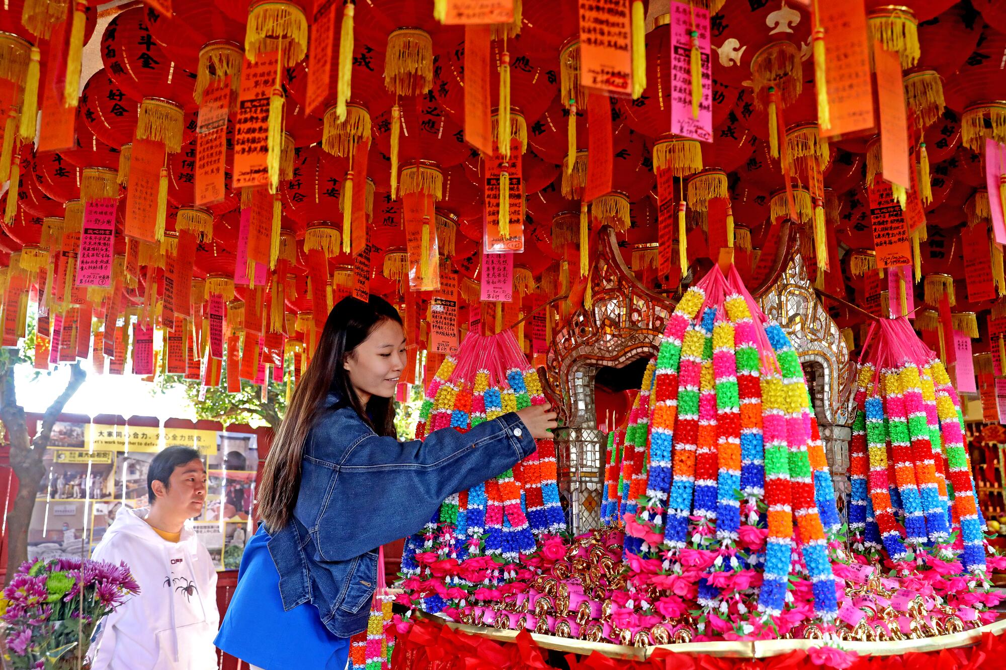 Two people at a temple.