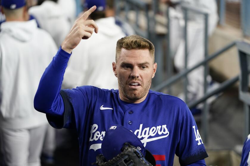 Dodgers' Freddie Freeman gestures in the dugout before a game against the Detroit Tigers on Sept. 18, 2023, in Los Angeles.