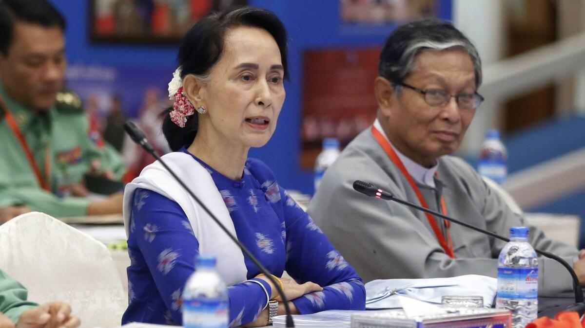 Aung San Suu Kyi, shown Nov. 27, has come under fire for her inaction on Myanmar's brutal violence against its Rohingya minority,