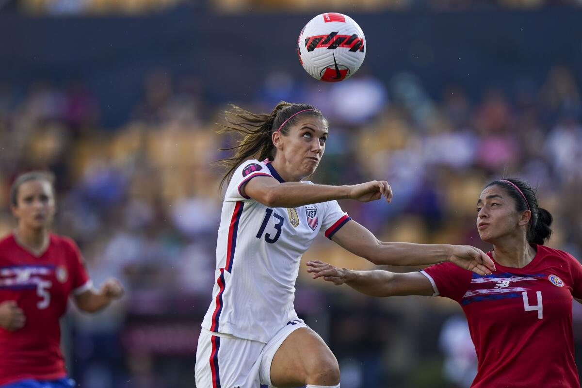 United States' Alex Morgan and Costa Rica's Mariana Benavides fight for the ball.