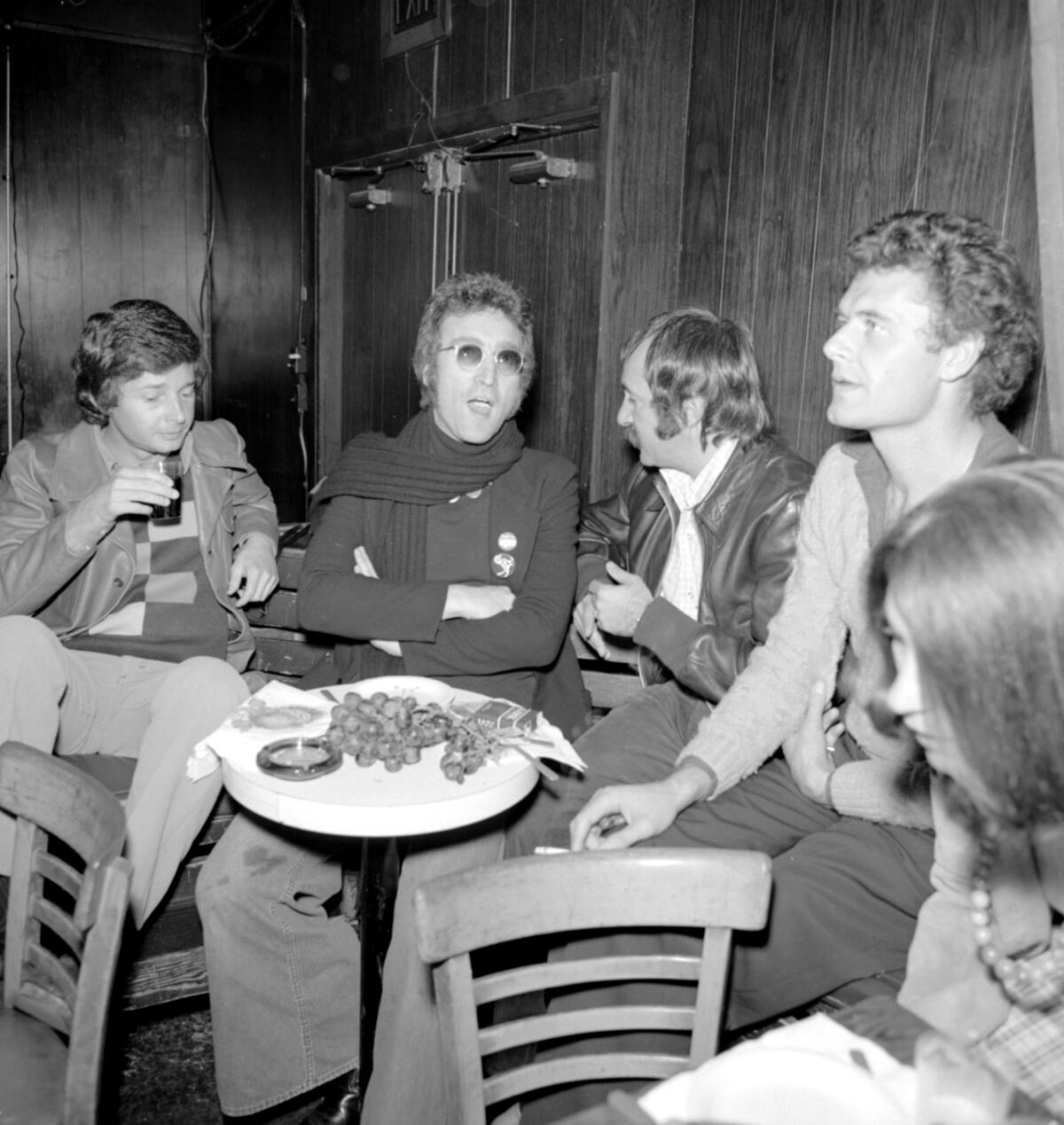 John Lennon (second from left) at the Troubadour in Los Angeles in 1973. The next year he'd get kicked out of the club with Pam Grier and send her a note, apologizing.