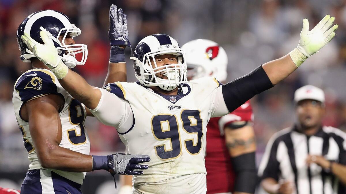 Rams defensive end Aaron Donald (99) reacts after a tackle during the second half against the Arizona Cardinals on Dec. 3, 2017.