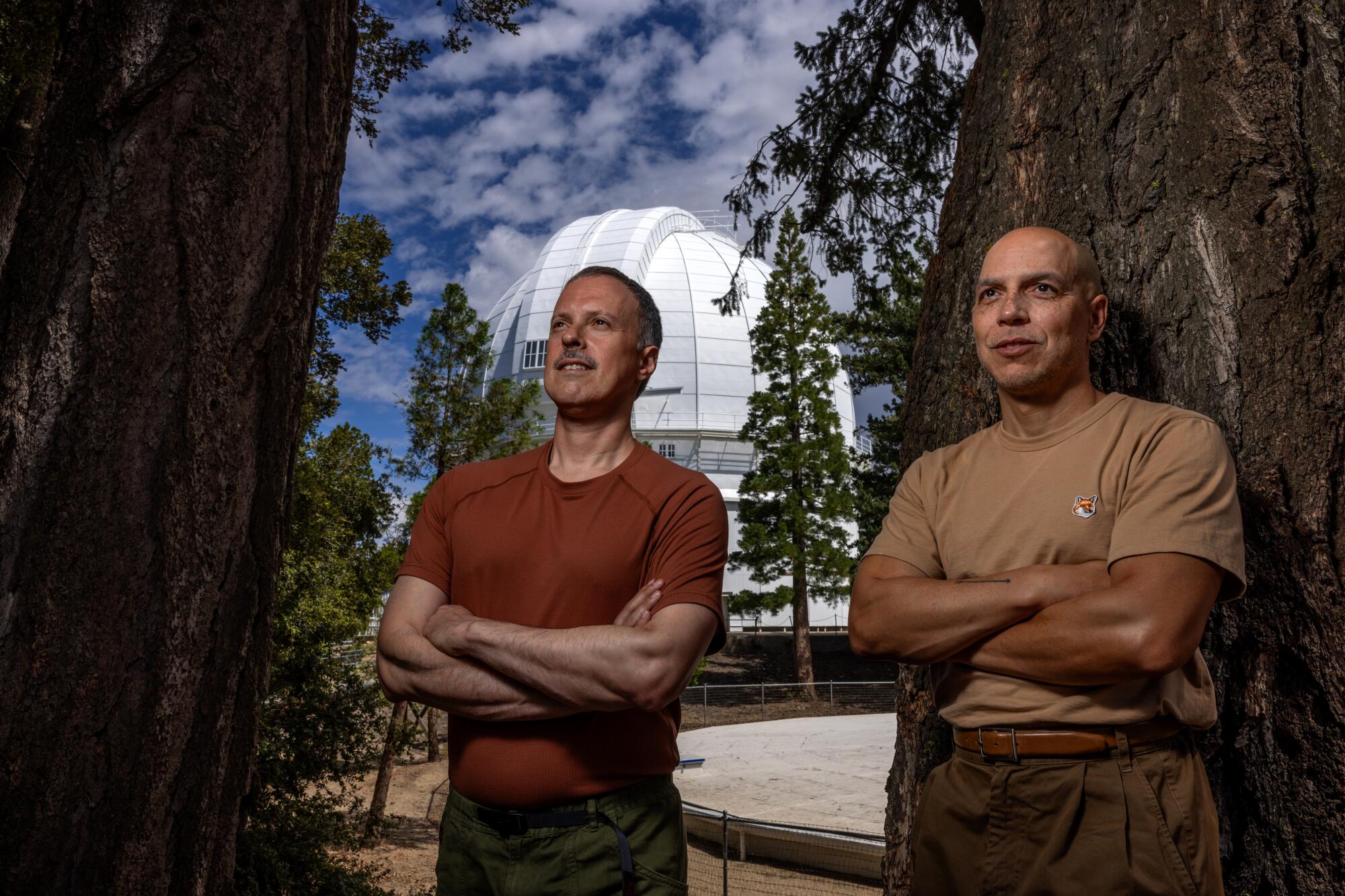 Alexandro Segade, left, and Malik Gaines stand outside vaulted dome at Mt. Wilson Observatory.