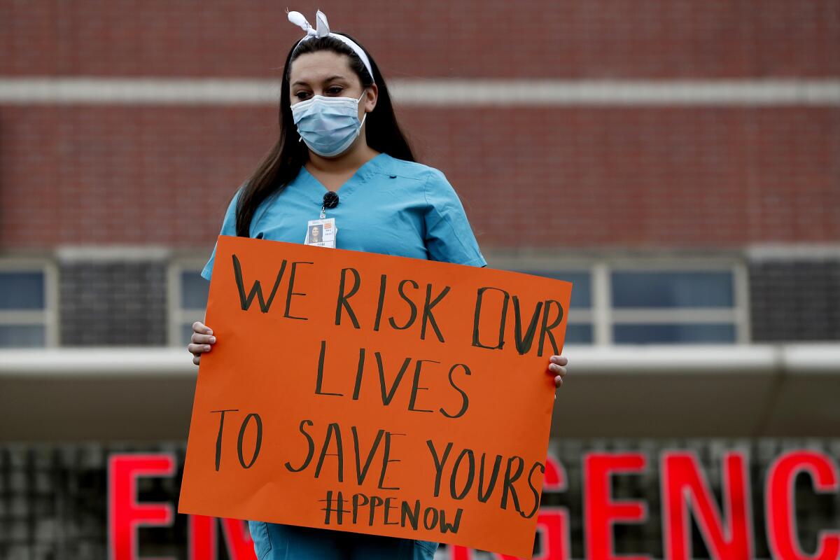 A nurse protests the lack of adequate protective equipment at a hospital in New York.