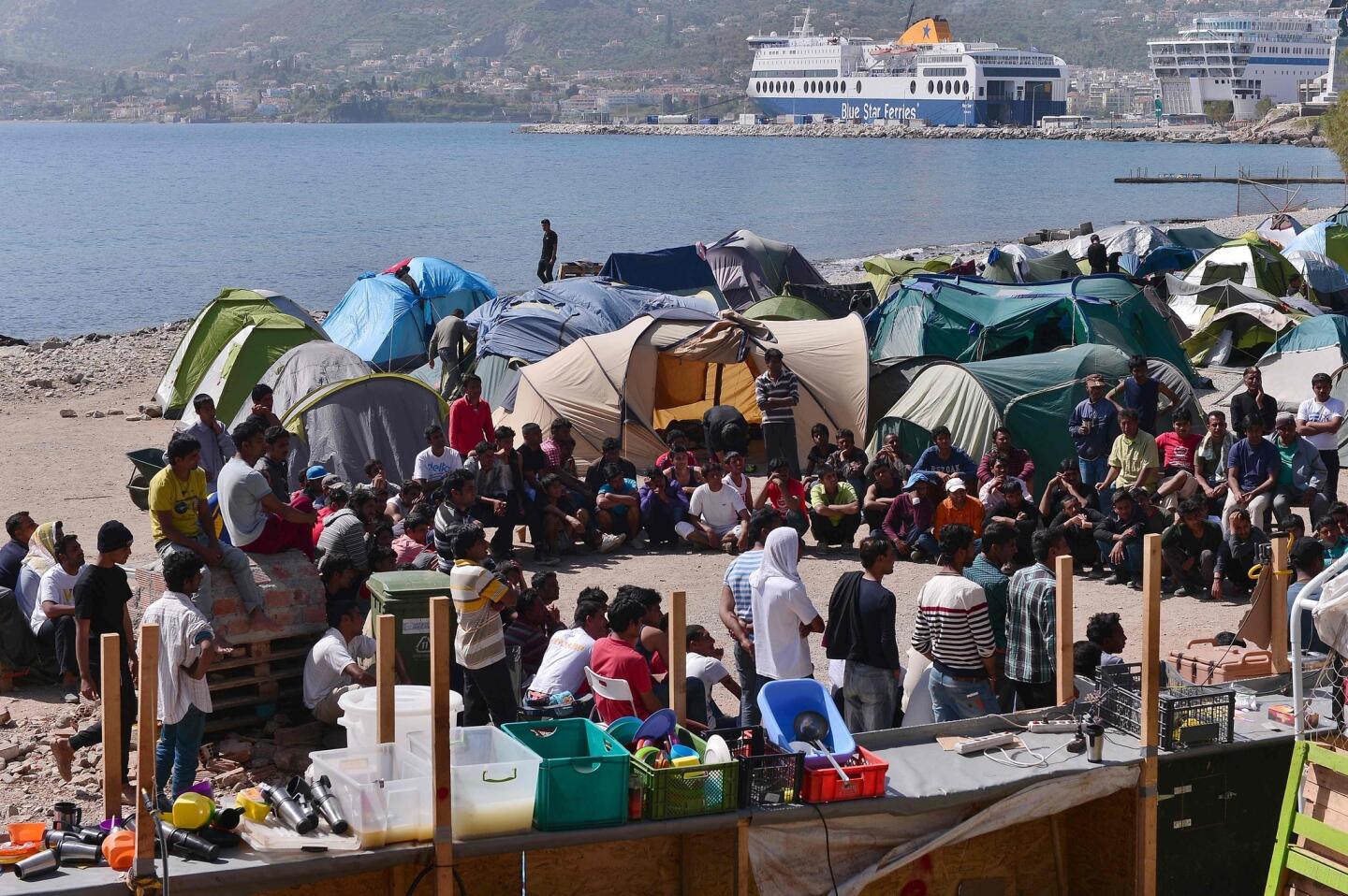 Migrants gather at the Moria refugee camp on the Greek island of Lesbos. Pope Francis will be visiting the camp on Saturday.