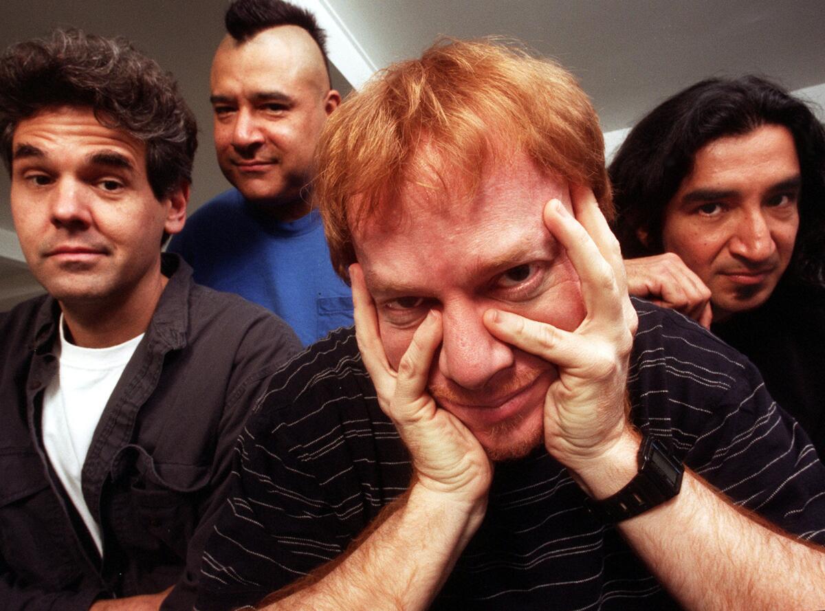 Danny Elfman, center, shown in 1996 with other members of the band Oingo Boingo, from left, Steve Bartek, John Avila and Johnny Vatos.