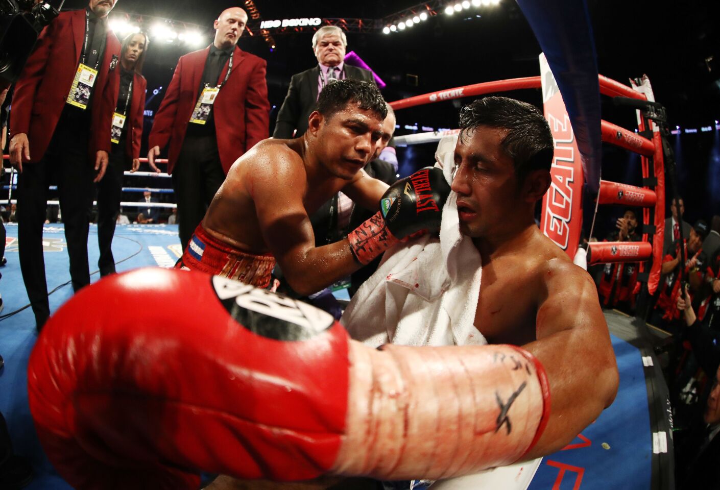 Roman Gonzalez consoles Moises Fuentes after knocking him out in the first round during their super flyweight bout at T-Mobile Arena on September 15, 2018 in Las Vegas, Nevada.