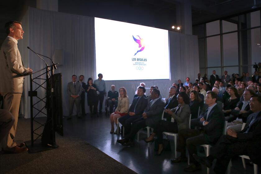 The LA 2024 candidate city logo for the city's bid for the 2024 Summer Olympics is revealed at an event featuring city mayor Eric Garcetti, left, LA 2024 Chairman Casey Wasserman, and more than 100 Olympians and Para Olympians.