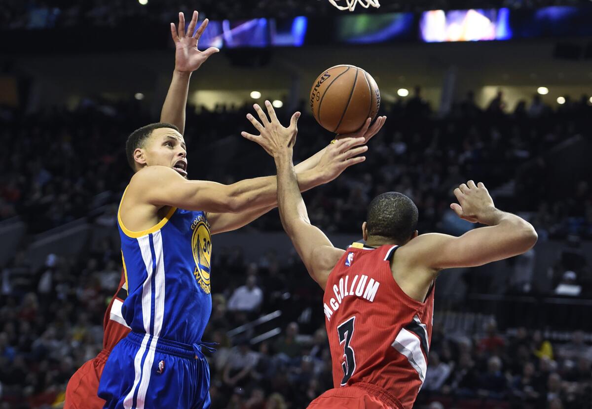 Golden State guard Stephen Curry drives to the basket against Portland guard C.J. McCollum during the second half of a game on Jan. 8.