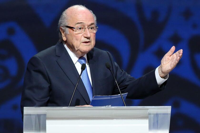 FIFA President Sepp Blatter delivers a speech ahead of the preliminary draw for the 2018 World Cup qualifiers at the Konstantin Palace in St. Petersburg, Russia, on July 25.