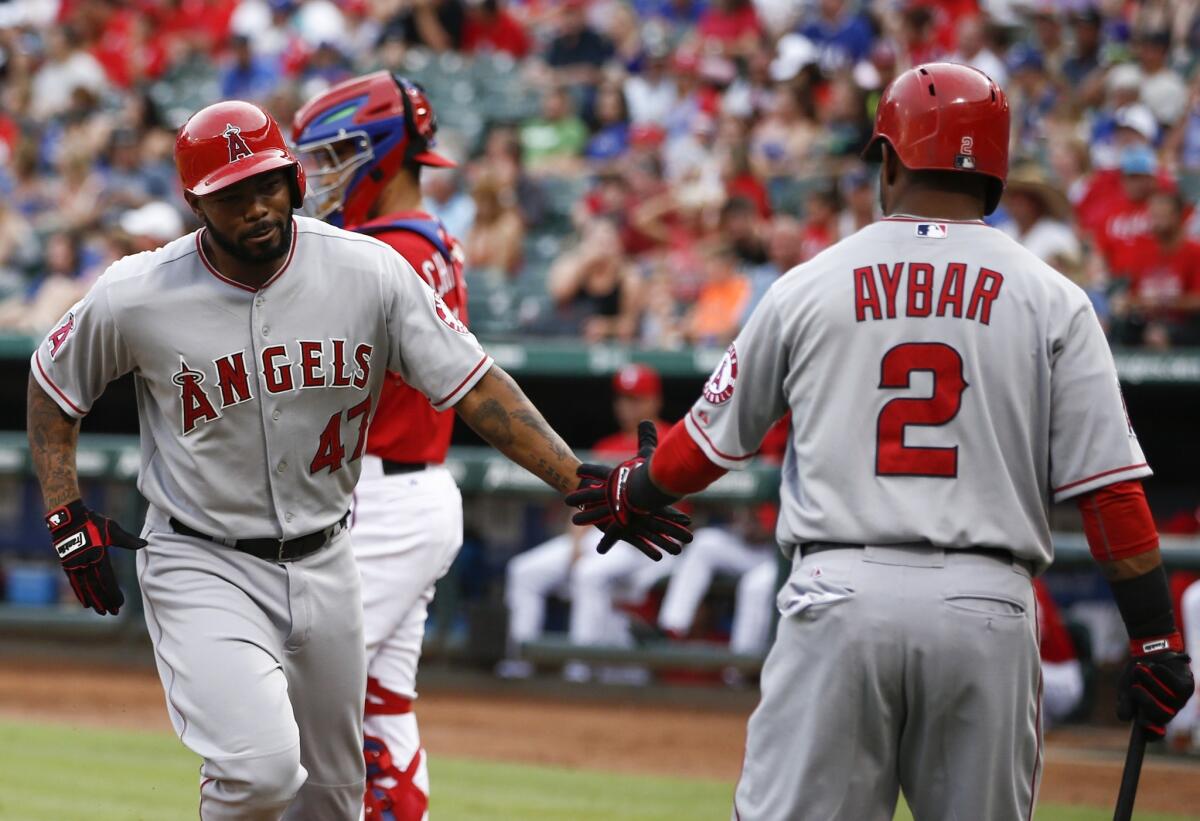Howie Kendrick (47) is congratulated by Erick Aybar (2) after his solo home run in the second inning of the Angels' 5-4 win Saturday over the Texas Rangers.