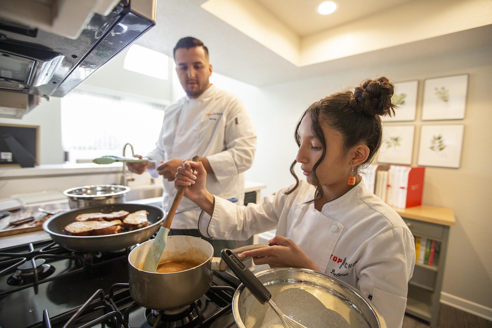 Delilah Flores and her Uncle Danny Flores prepare stuffed French toast.