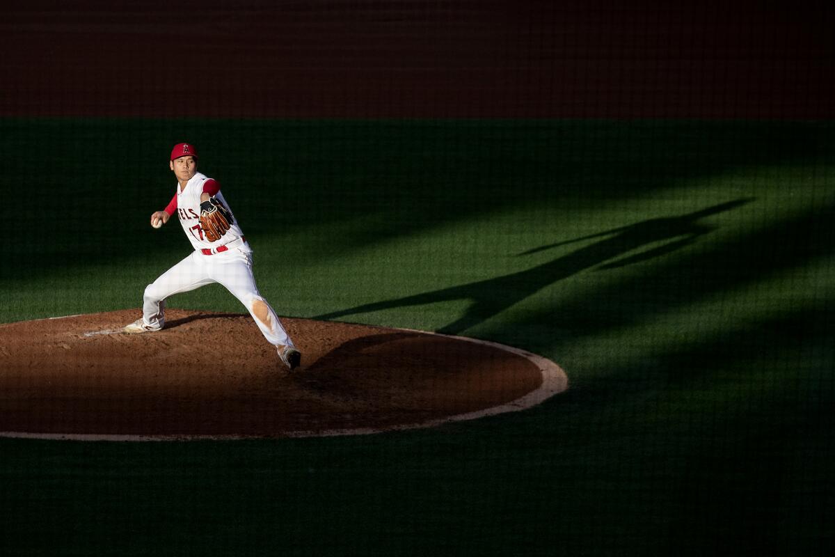 Ohtani pitches against his future Dodger teammates at Angels Stadium in June. In November he is declared the American League MVP, the first player to win by unanimous vote twice.