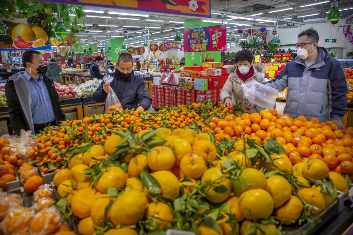 Shoppers at a supermarket in Beijing on Jan. 28.