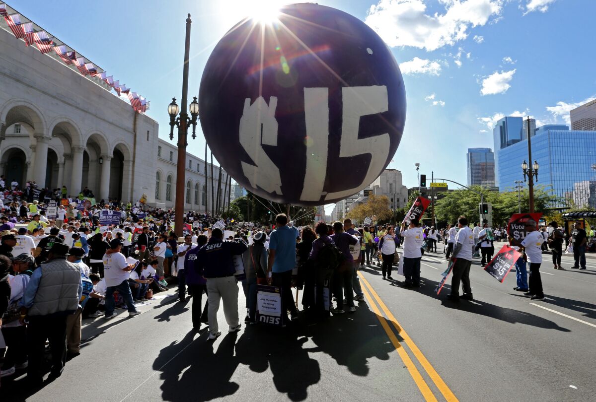 Workers rally outside Los Angeles City Hall on Nov. 10, 2015, to press demands for a minimum wage of $15 per hour.