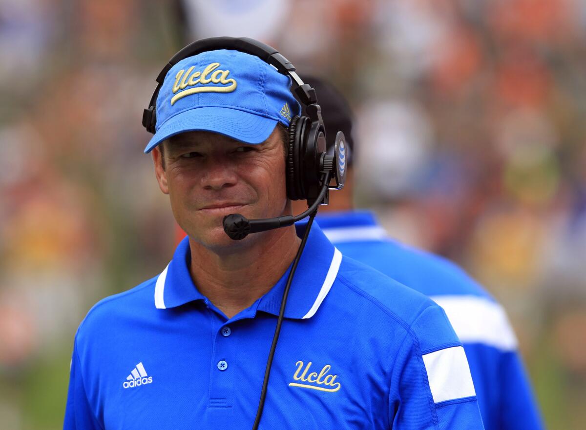 UCLA Coach Jim Mora watches his team play against Virginia on Saturday.