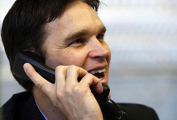 Luc Robitaille is all smiles while receiving the official call that announced his entry into the Hockey Hall of Fame. He got the news while working at the Kings' offices at the Toyota Sports Center in El Segundo.