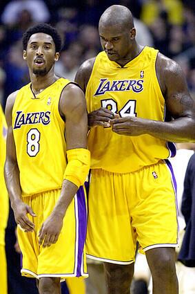 Lakers guard Kobe Bryant and center Shaquille O'Neal talk strategy as they exit a huddle during a game against the Cleveland Cavaliers.