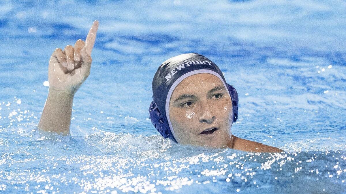 Newport Harbor High's Makoto Kenney celebrates after scoring a goal against Westlake Village Oaks Christian in the semifinals of the CIF Southern Section Division 1 playoffs at Irvine's Woollett Aquatic Center on Wednesday.