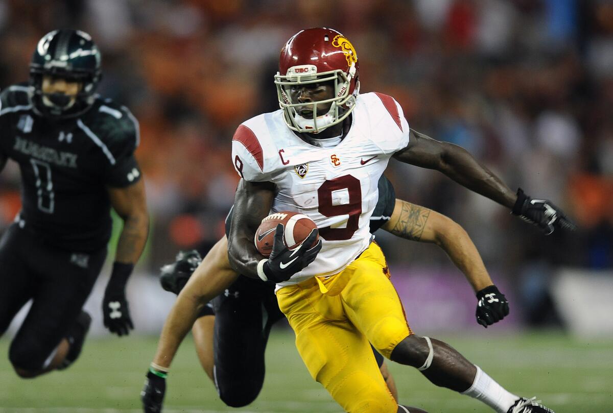 Marquis Lee picks up yards after a reception against Hawaii at Aloha Stadium.