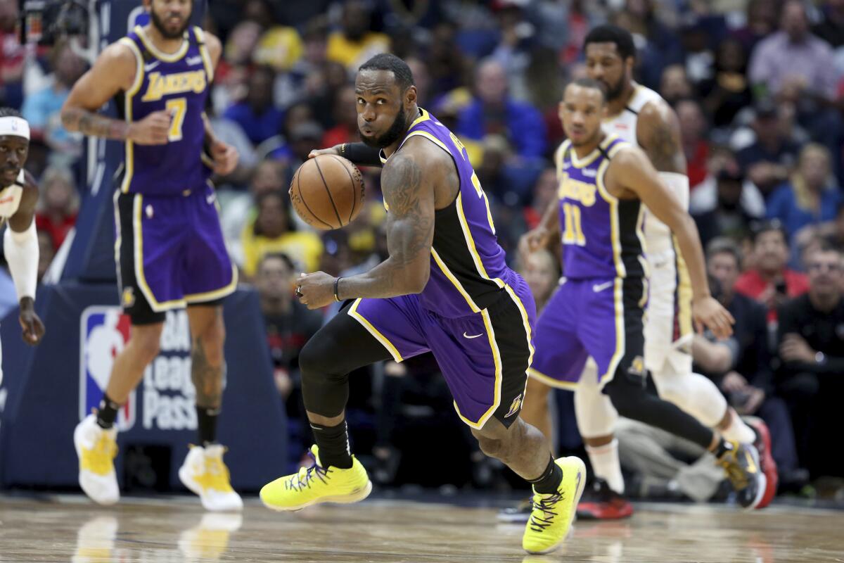 LeBron James drives to the basket during the Lakers' win over the New Orleans Pelicans on Sunday night.