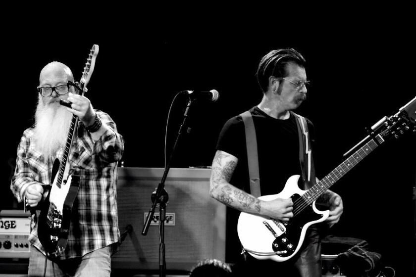 Dave Catching, left, and Jesse Hughes of Eagles of Death Metal perform in Los Angeles in October.