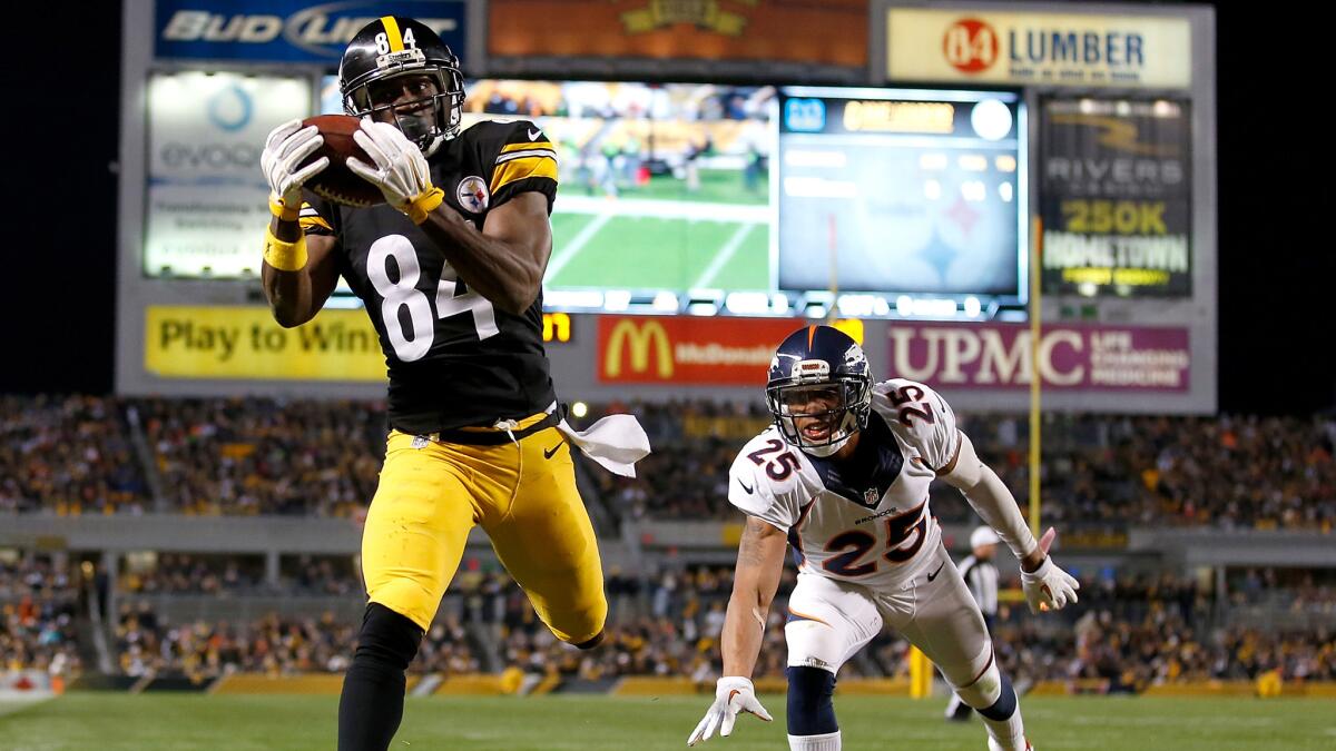 Steelers wide receiver Antonio Brown secures a touchdown catch against the Broncos in the third quarter Sunday.