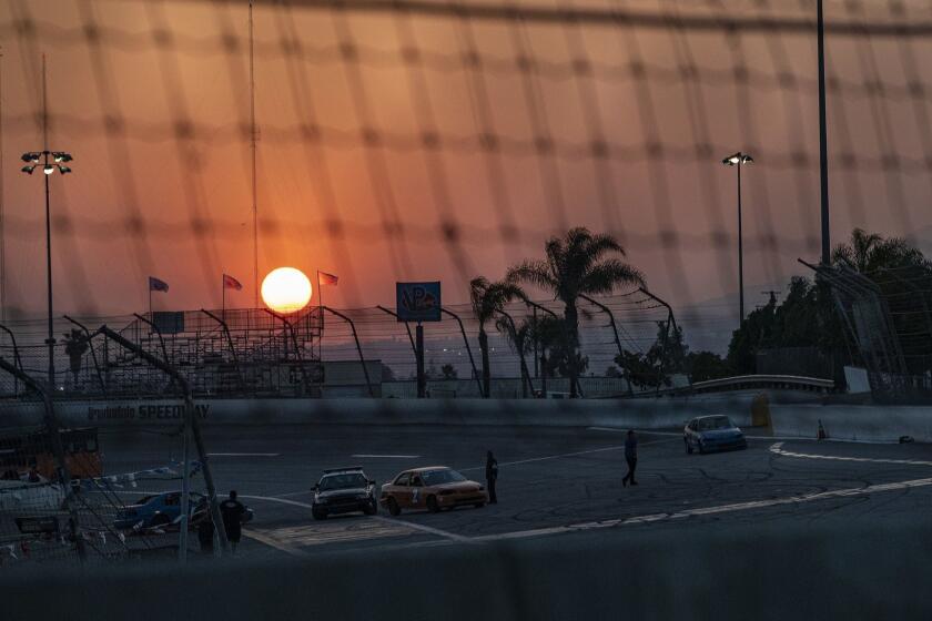 IRWINDALE, CA - JUNE 15, 2019: The sunsets behind the track during the "Summer Mayhem" event at the Irwindale Speedway on June 15, 2019 in Irwindale, California.(Gina Ferazzi/Los AngelesTimes)