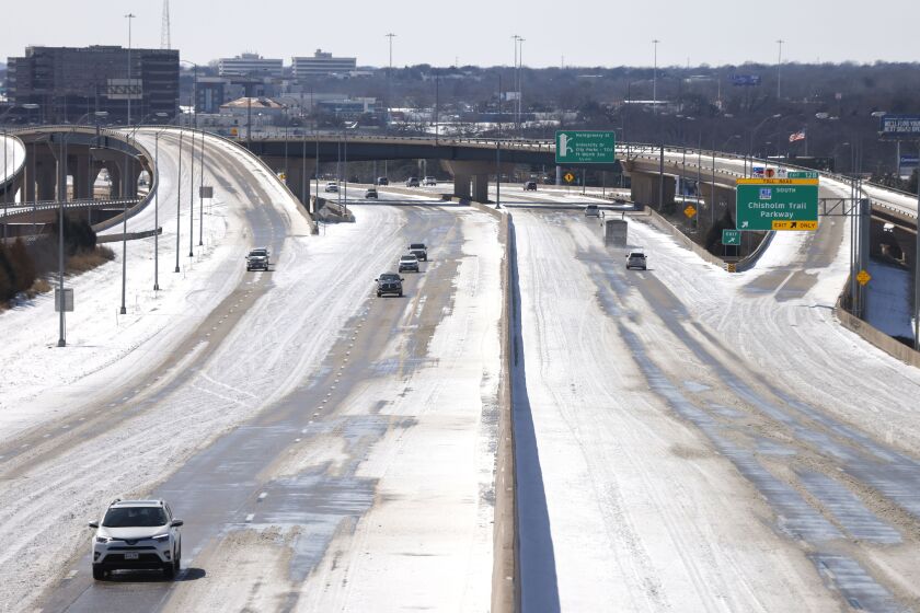 FORT WORTH, TX - FEBRUARY 15: Traffic moves along Interstate 30 after a snow storm February 15, 2021 in Fort Worth, Texas. Winter storm Uri has brought historic cold weather to Texas and storms have swept across 26 states with a mix of freezing temperatures and precipitation. (Photo by Ron Jenkins/Getty Images)