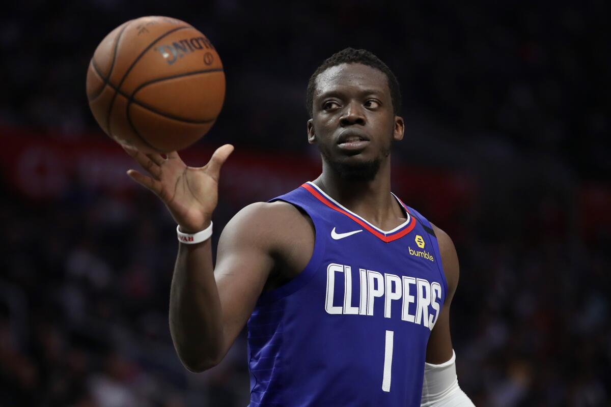 Clippers Reggie Jackson handles the ball in a game against the Sacramento Kings.