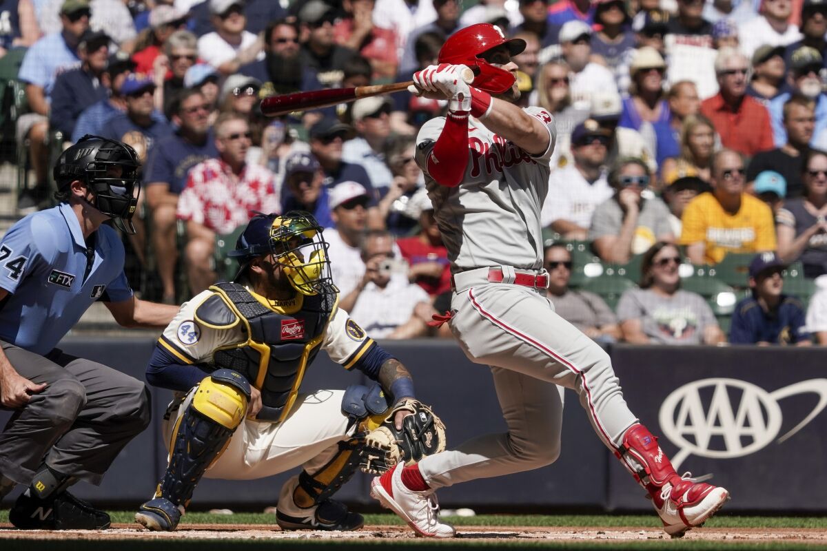 Philadelphia Phillies' Bryce Harper hits a two-run home run during the first inning of a baseball game against the Milwaukee Brewers Monday, Sept. 6, 2021, in Milwaukee. (AP Photo/Morry Gash)