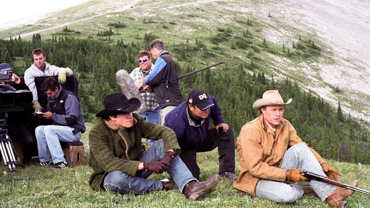 Jake Gyllenhaal, left, director Ang Lee and Heath Ledger on the set of "Brokeback Mountain," a Focus Features release. (Focus Features)