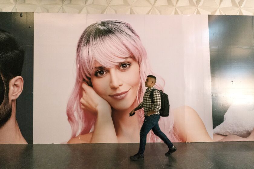 An ad greets passersby at the new Mitikah mall in Mexico City.