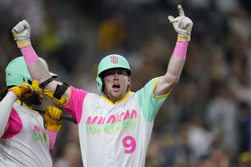 San Diego Padres' Jake Cronenworth celebrates his two-run home run with teammates during the sixth inning of a baseball game against the Chicago White Sox, Saturday, Oct. 1, 2022, in San Diego. (AP Photo/Gregory Bull)