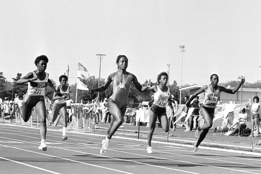 American record holder Evelyn Ashford, second from right, leads the field to a wind-aided record of 10.85 in the 100-meter dash at the Modesto Invitational track and field competition in Modesto, Calif., May 14, 1983. World record for the distance is 10.88. At left is Chandra Cheeseborough, who placed second. At right is third place winner Jennifer Innis, and second from left is Alice Brown in lane 3. (AP Photo/Sal Veder)