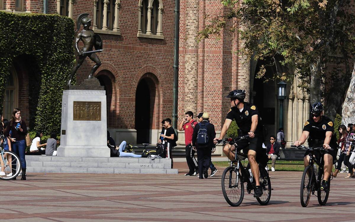 USC Department of Public Safety officers on bikes patrol on campus the day after several young men were shot at a Halloween party there.