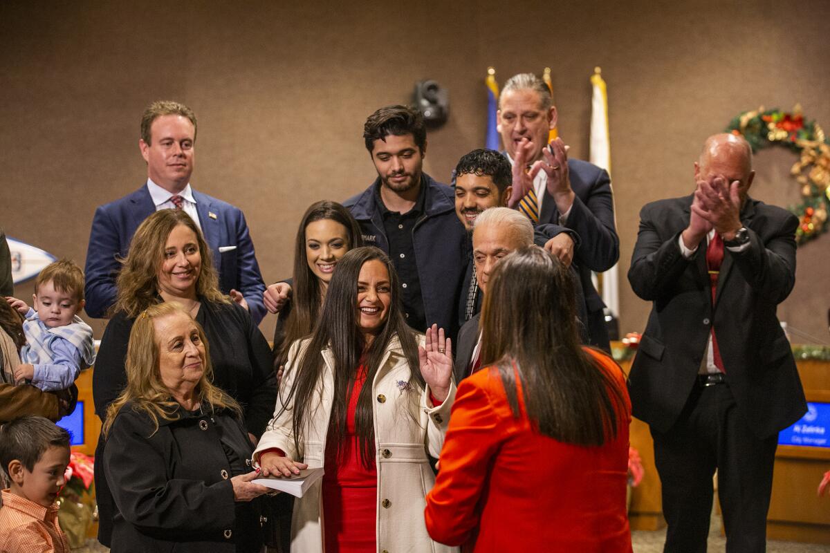 State Sen. Janet Nguyen swears in Gracey Van Der Mark at the Huntington Beach City Council chambers on Tuesday.