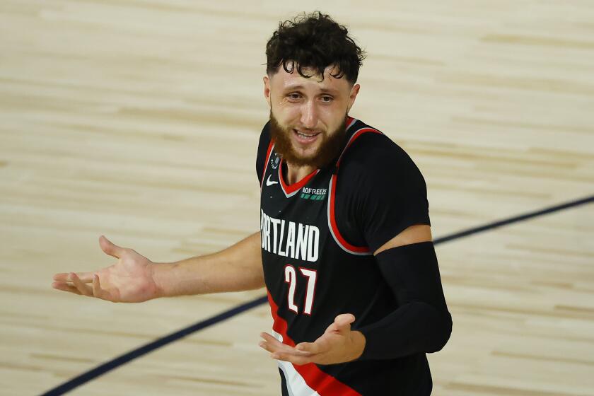 The Portland Trail Blazers' Jusuf Nurkic throws up his arms against the Memphis Grizzlies on. Aug. 15, 2020.