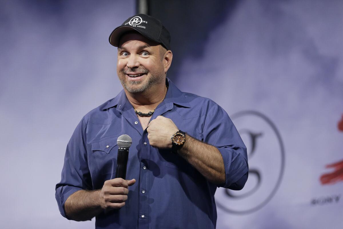 Country music star Garth Brooks, shown at a July 10 news conference in Nashville, will launch his first world tour in 13 years on Sept. 4 in Chicago.